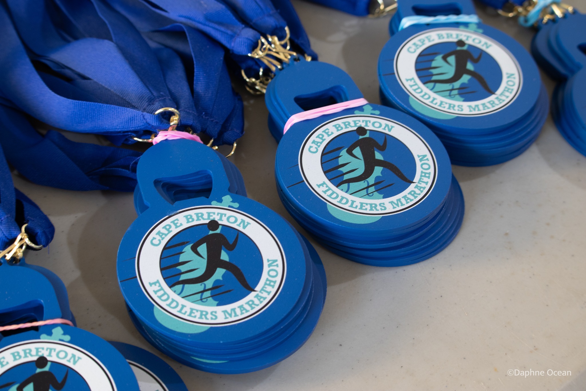 Custom medals manufactured by Protocase for the Fiddlers Run event